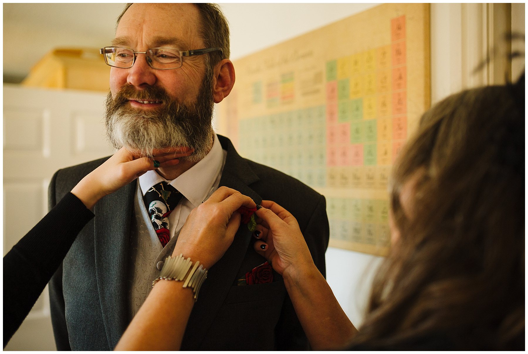 father of the bride has button hole fixed