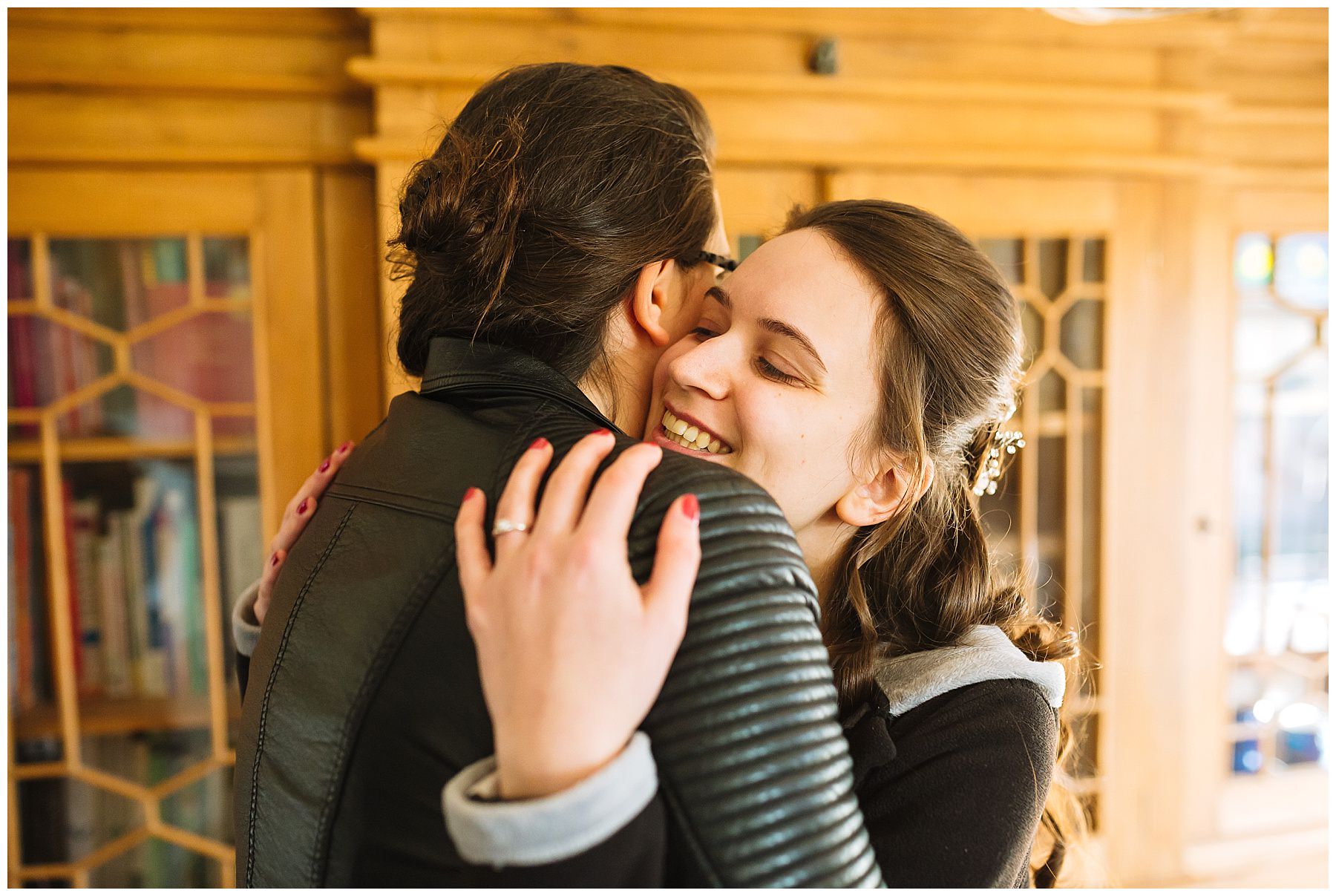 Big hugs between the bride and bridesmaid