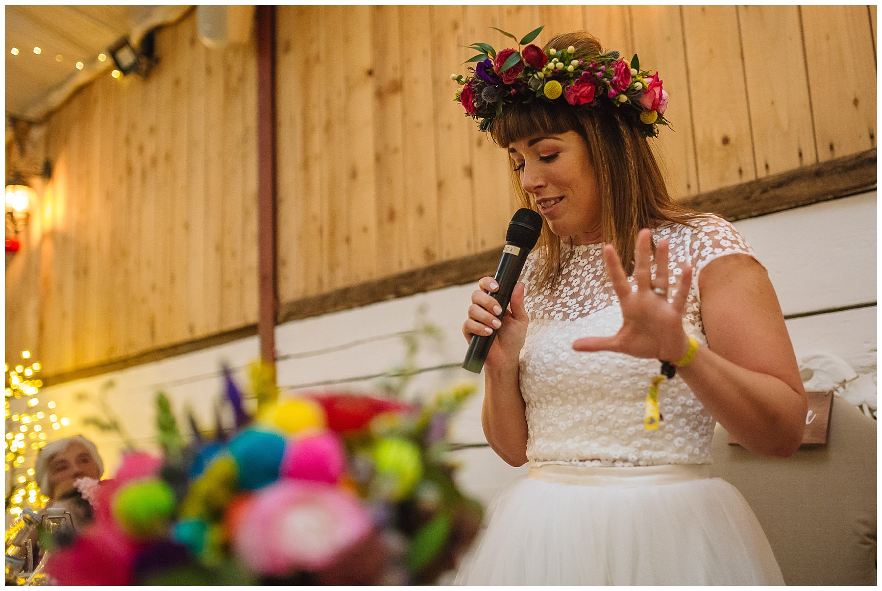 bride breaks with tradition and addresses guests at farm wedding in bolton
