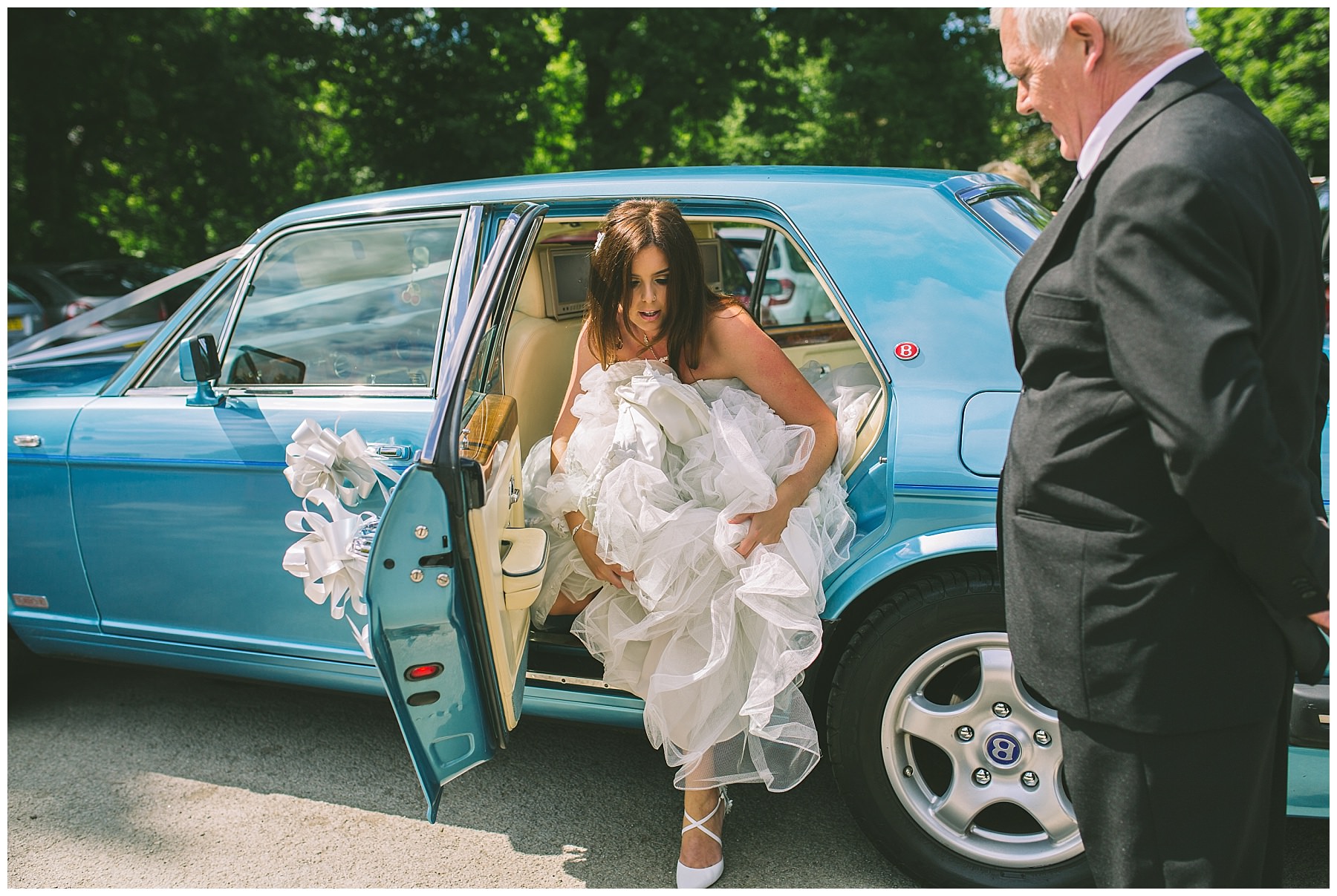 bride steps out of wedding car