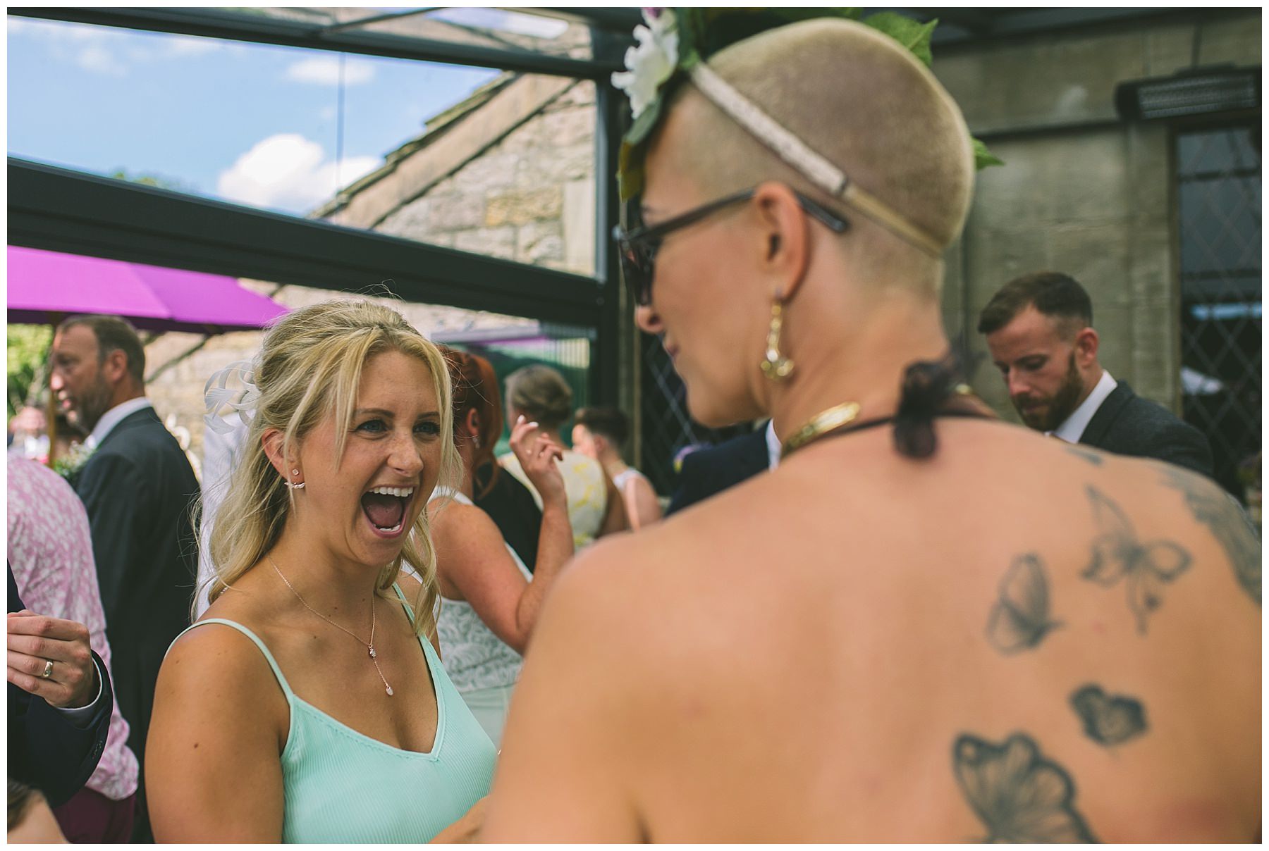 wedding guests enjoying the sun at rivington barn