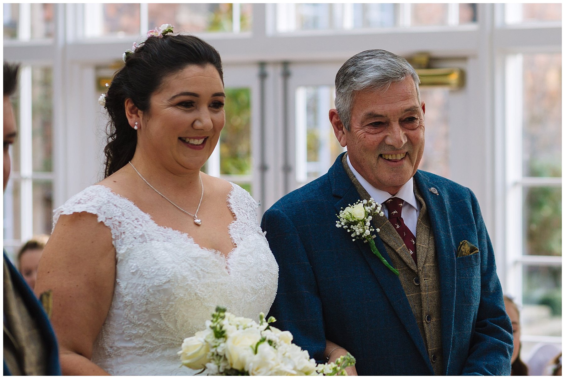 bride and dad smile during willington hall wedding