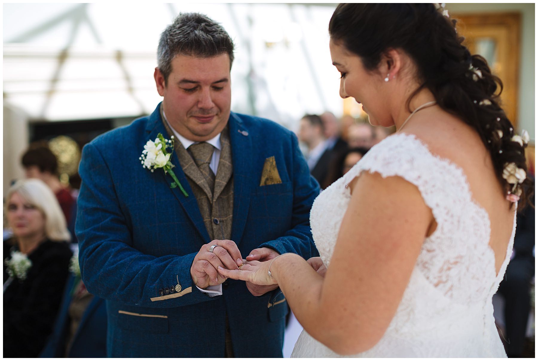 wedding ring exchange during willington hall wedding ceremony