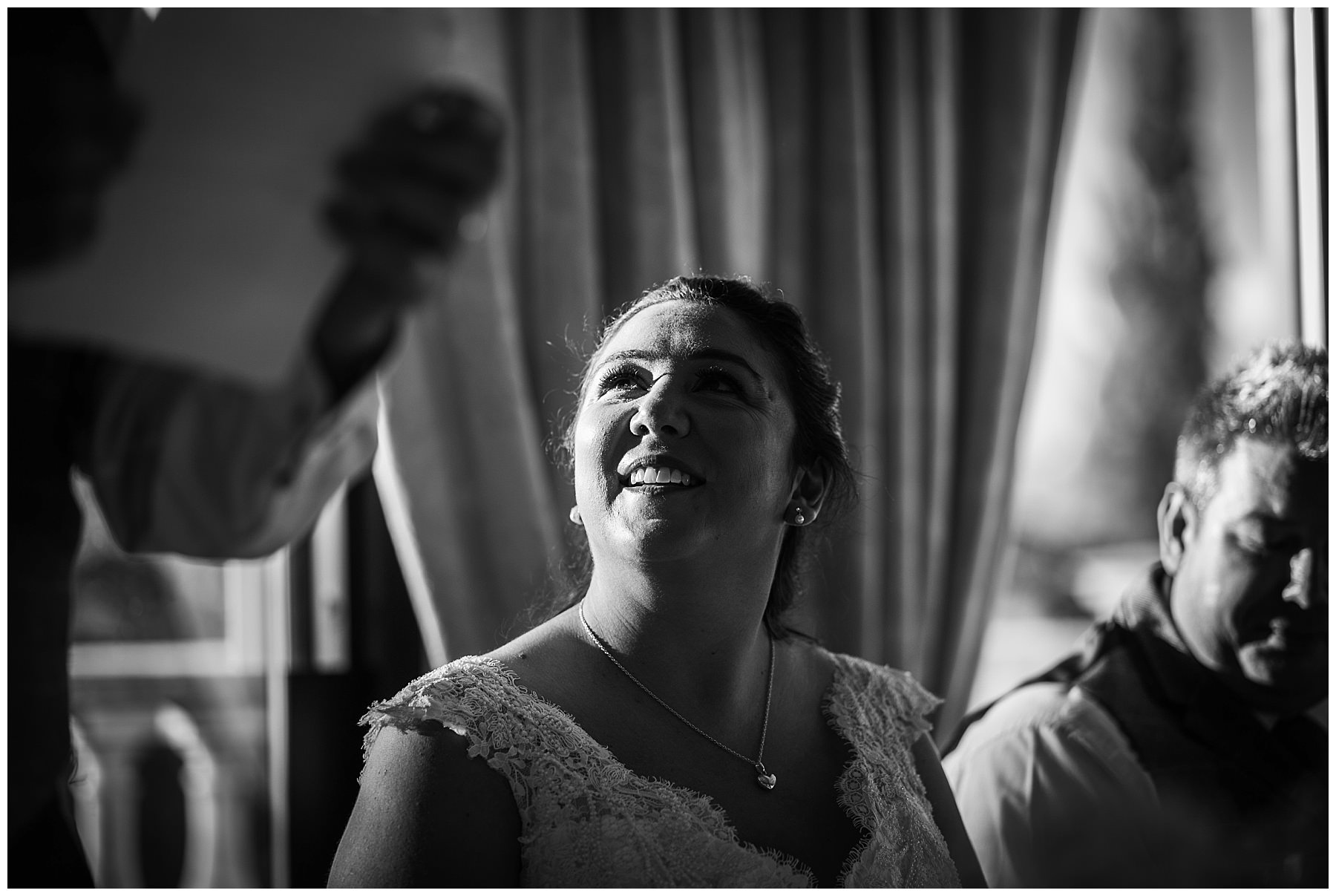 bride looks up to father during his speech