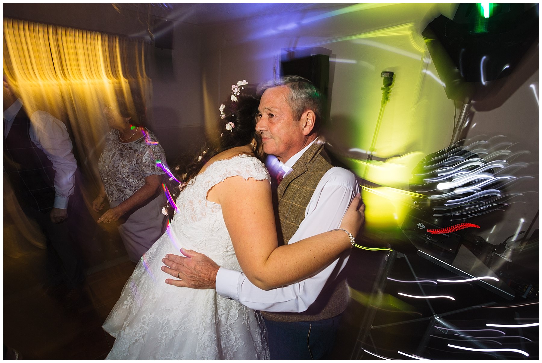 bride hugs dad on the dancefloor at willington hall