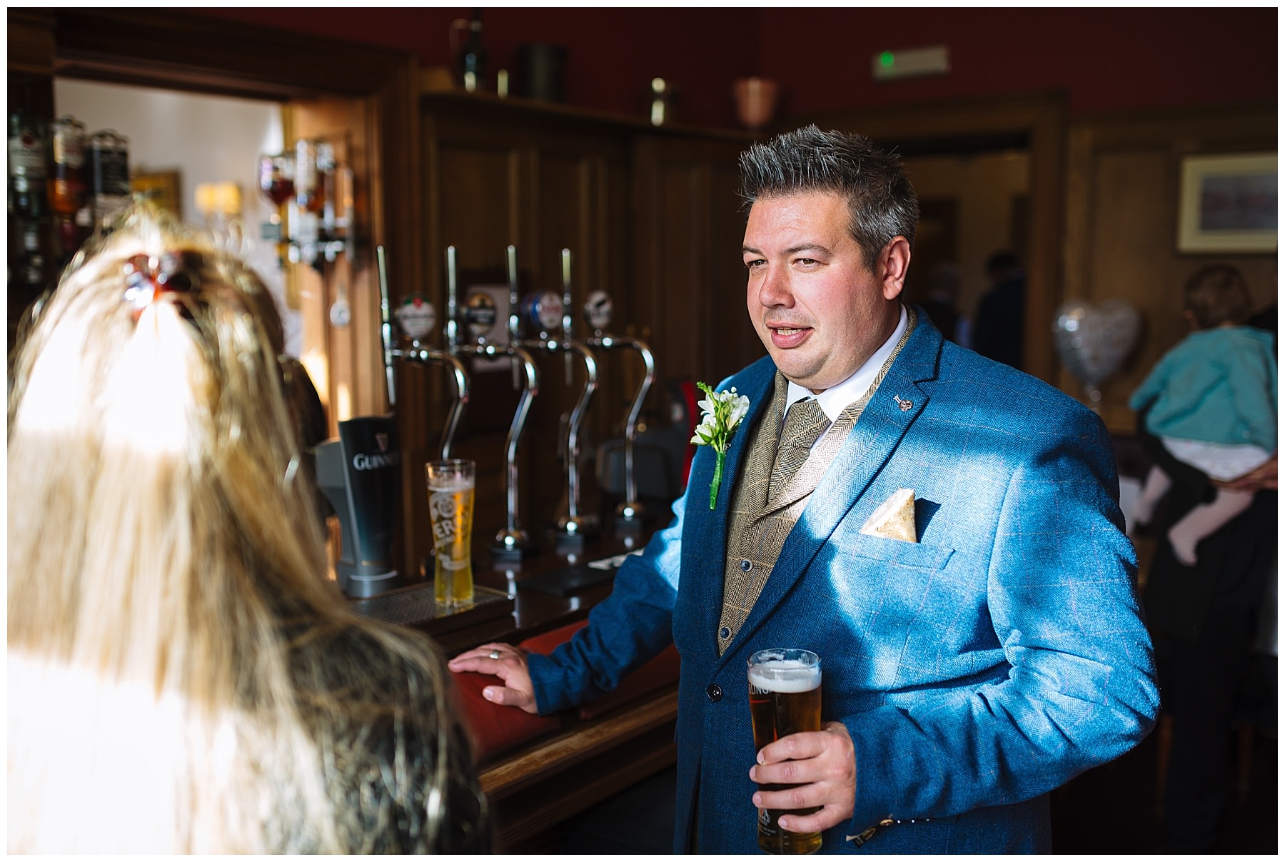 groom enjoys pre wedding pint at willington hall