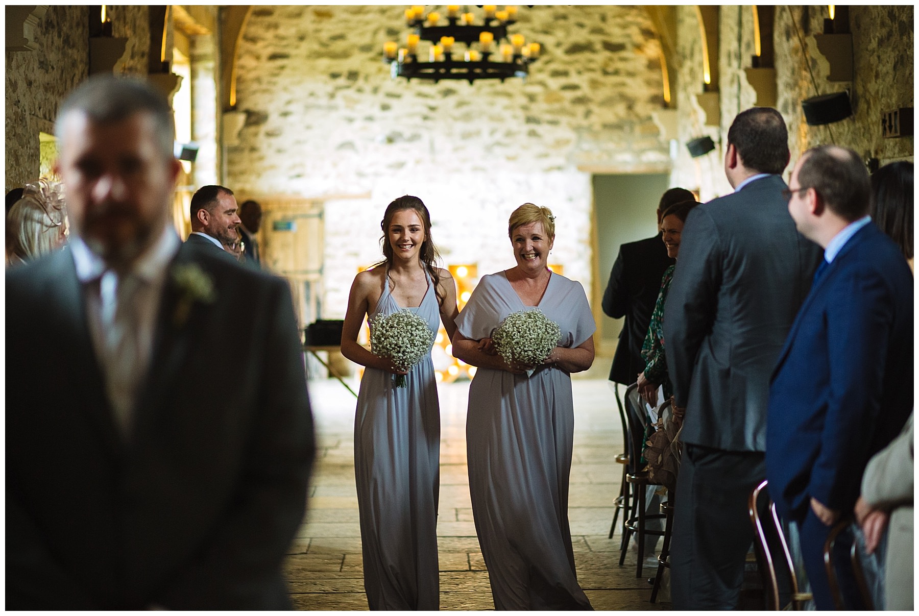 bridesmaids arrive for wedding ceremony at healey barn