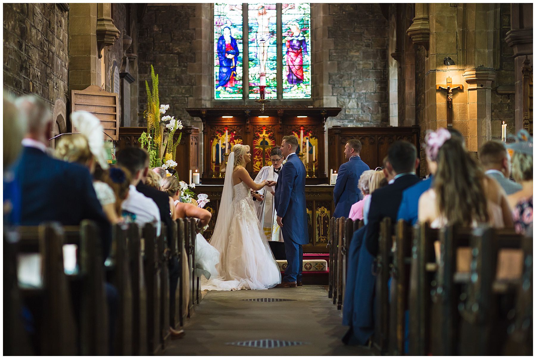 bride and groom exchange vows in stunning beautiful bolton church