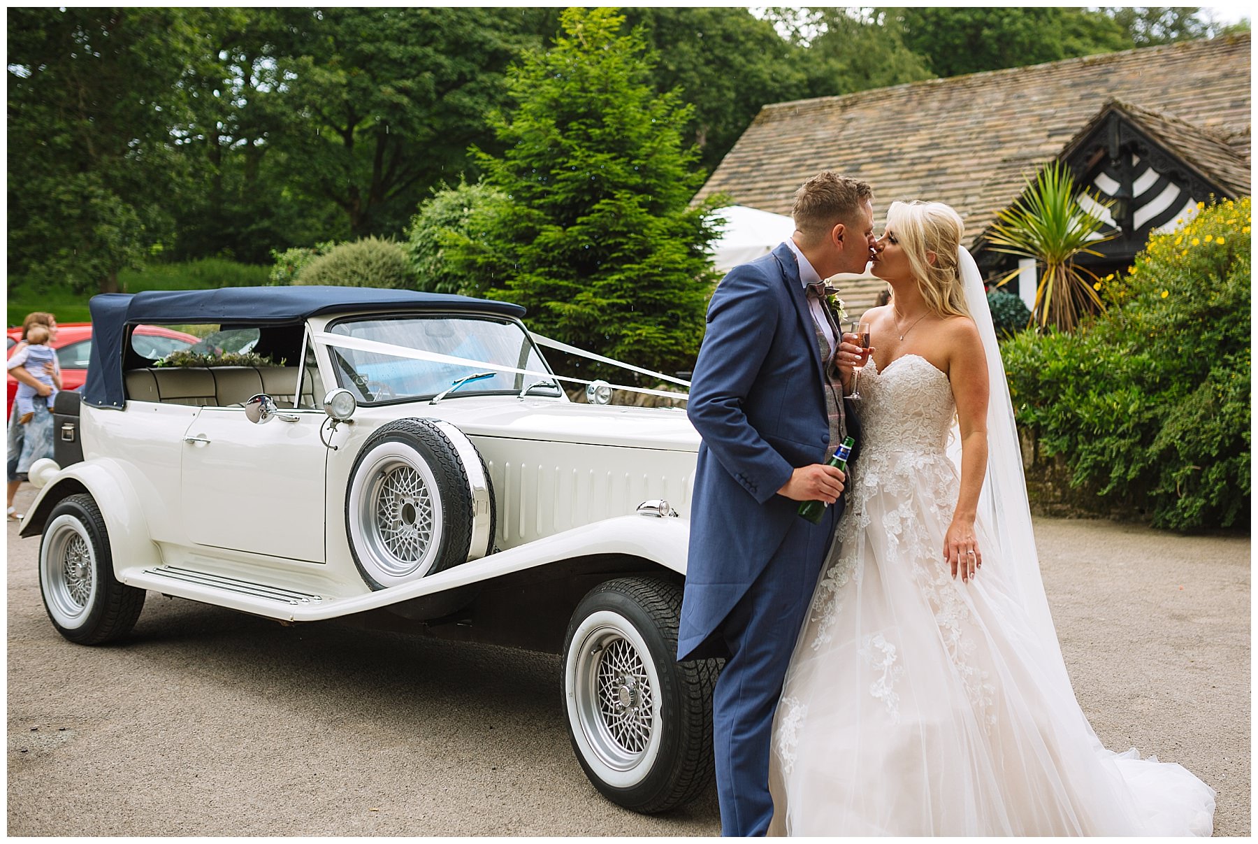 bride and groom share a moment as they arrive at rivington barn