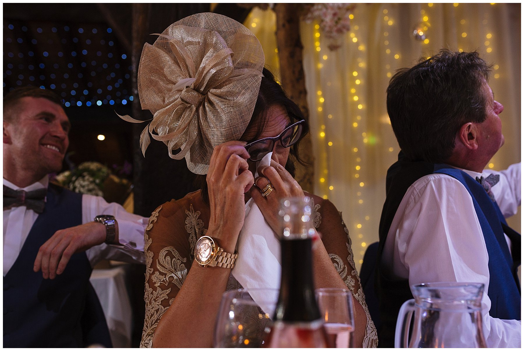 mother of the groom wipes her tears during her sons speech