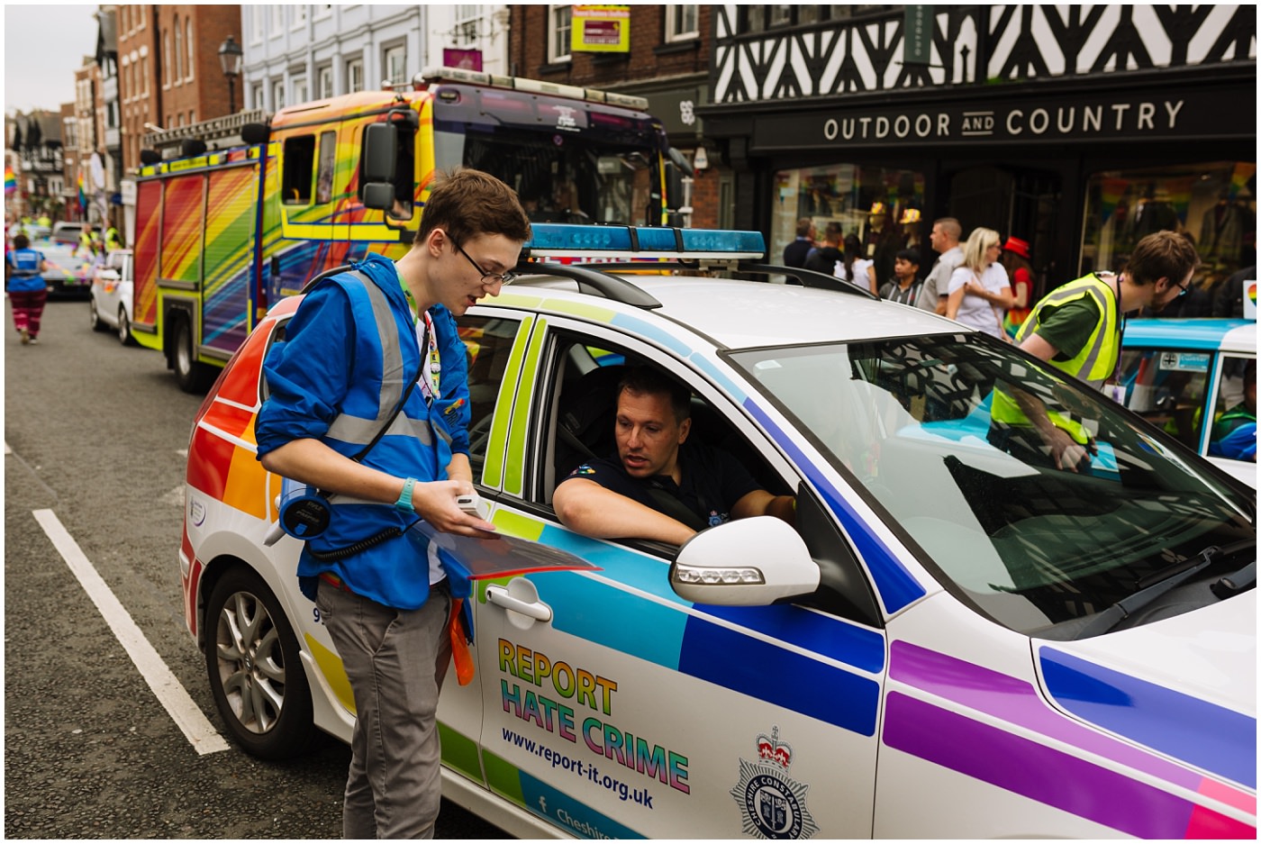 Marshal at chester pride liaises with the first car in the parade 