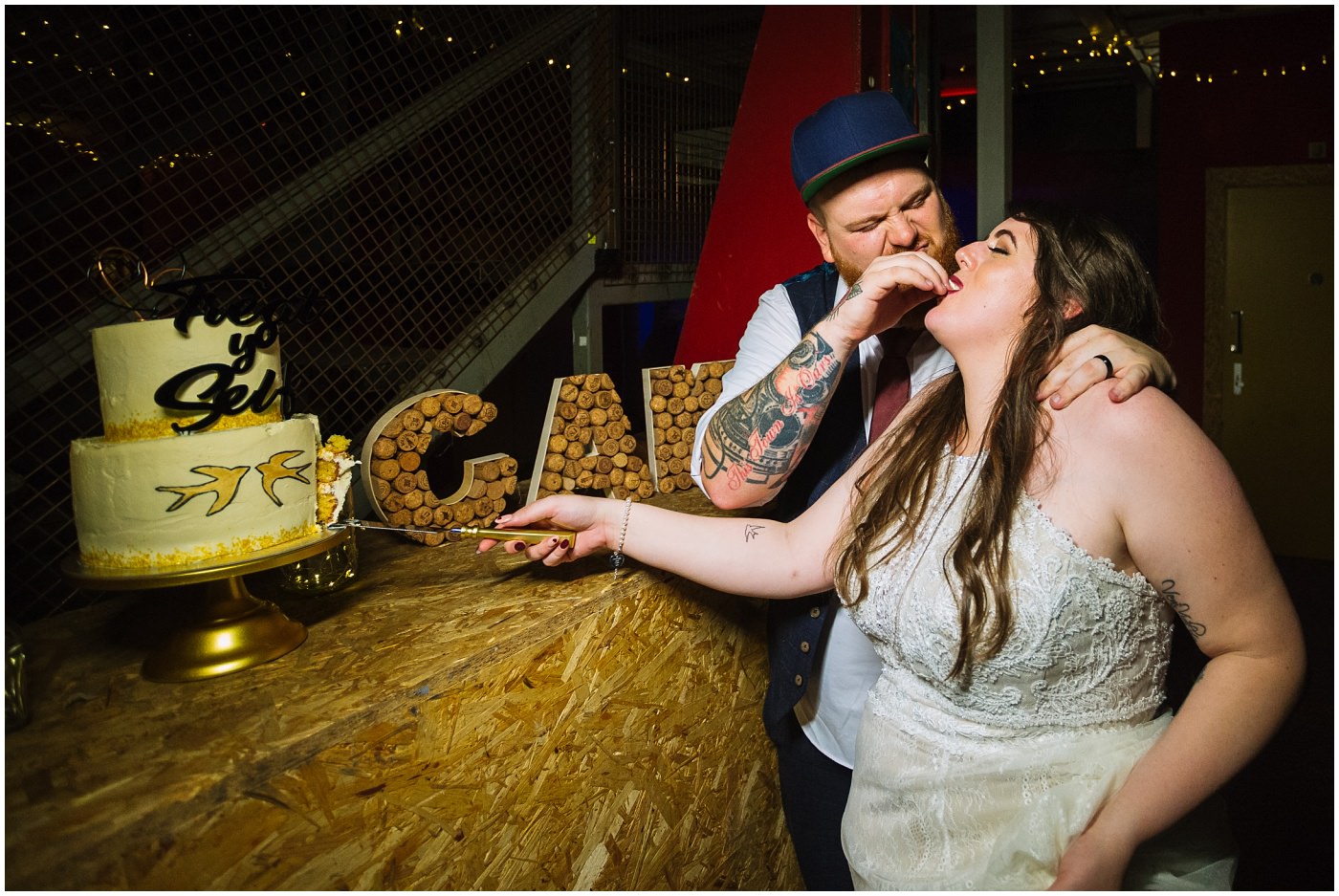 groom force feeds bride cake at manchester city centre wedding