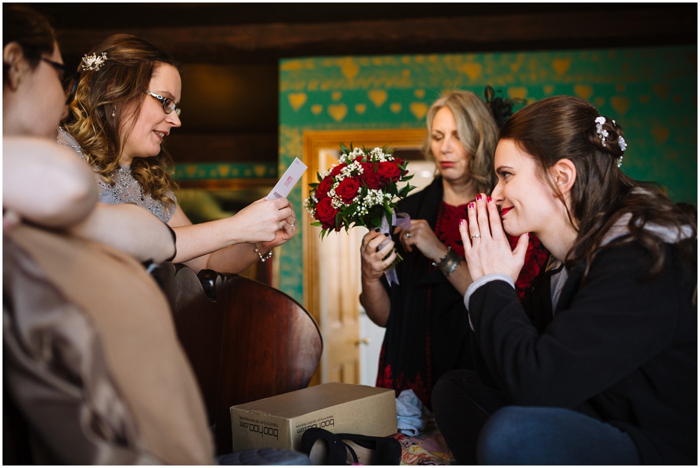 bridesmaids read wedding card to bride on the morning of her wedding