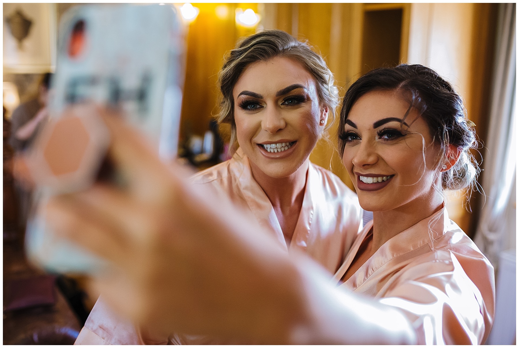 bridesmaids take a selfie during bridal prep