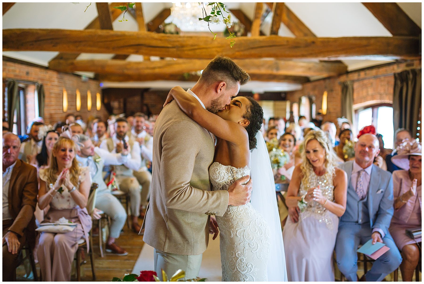 bride and grooms first kiss at swancar farm