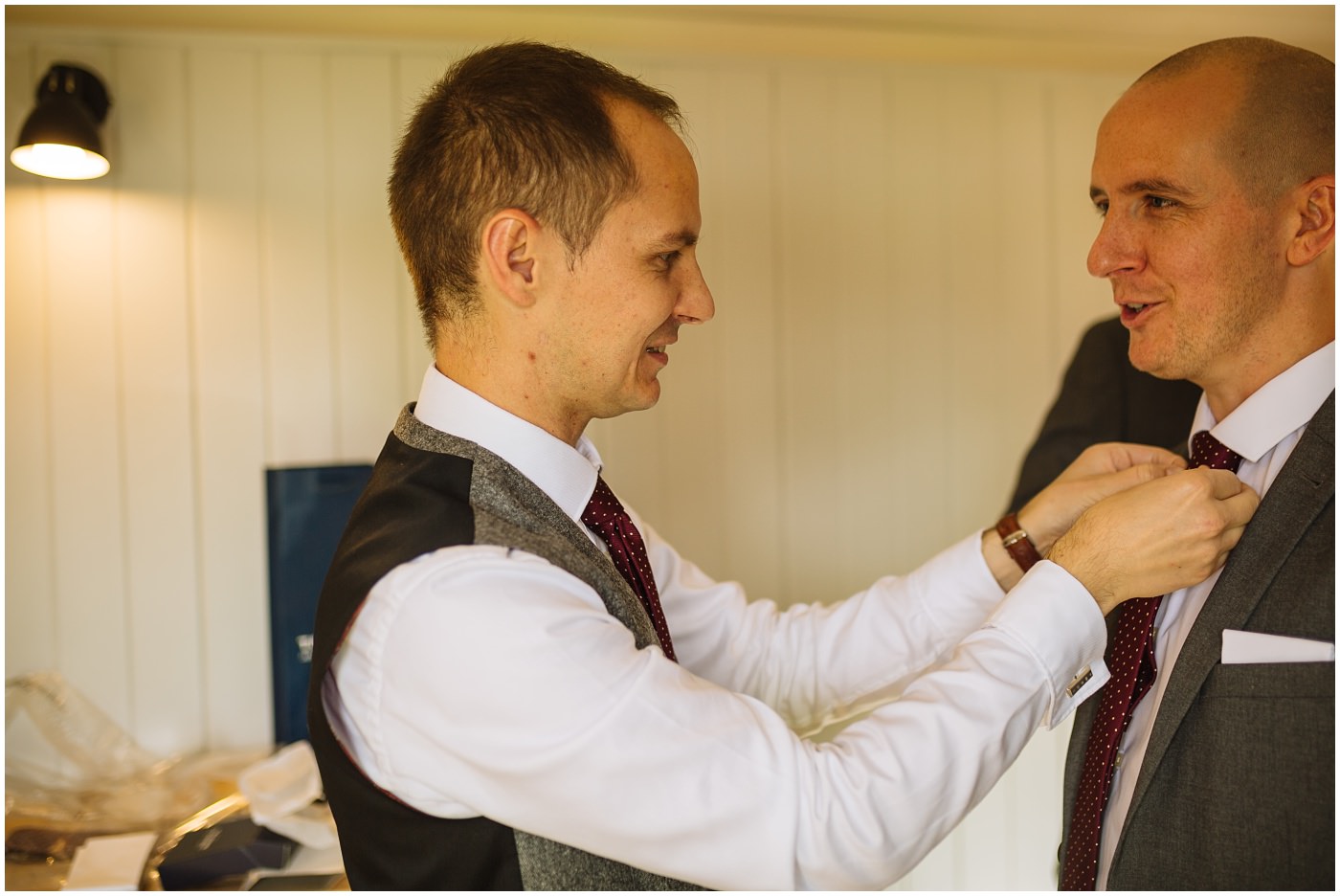 groom fixes best mans tie at sandhole oak barn