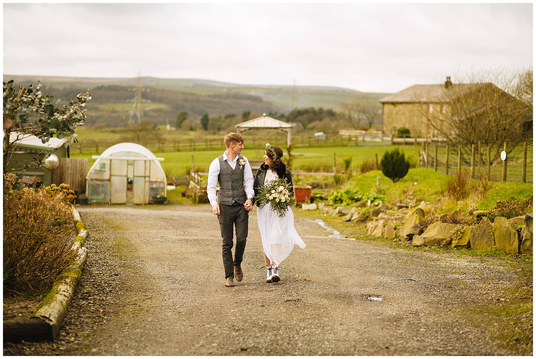 couple take a stroll through the grounds of the wellbeing farm
