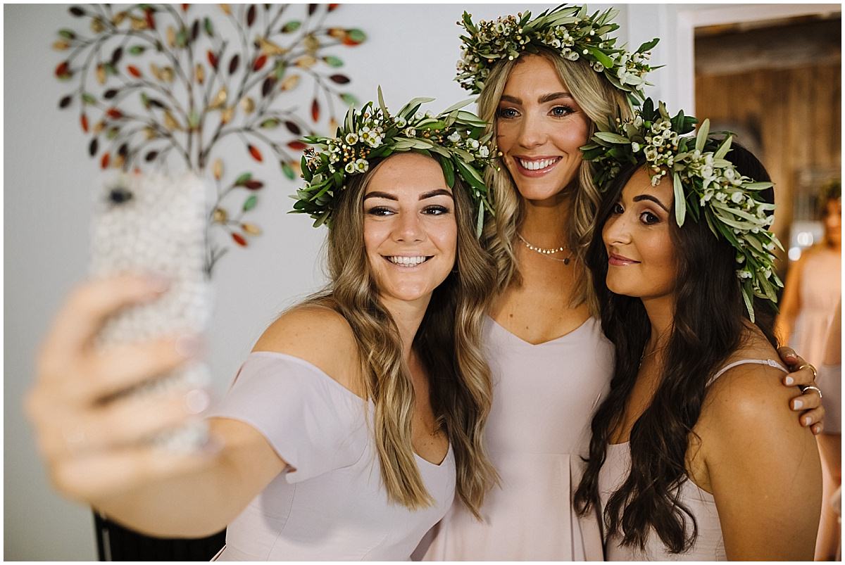 bridesmaids take a selfie ahead of wedding ceremony