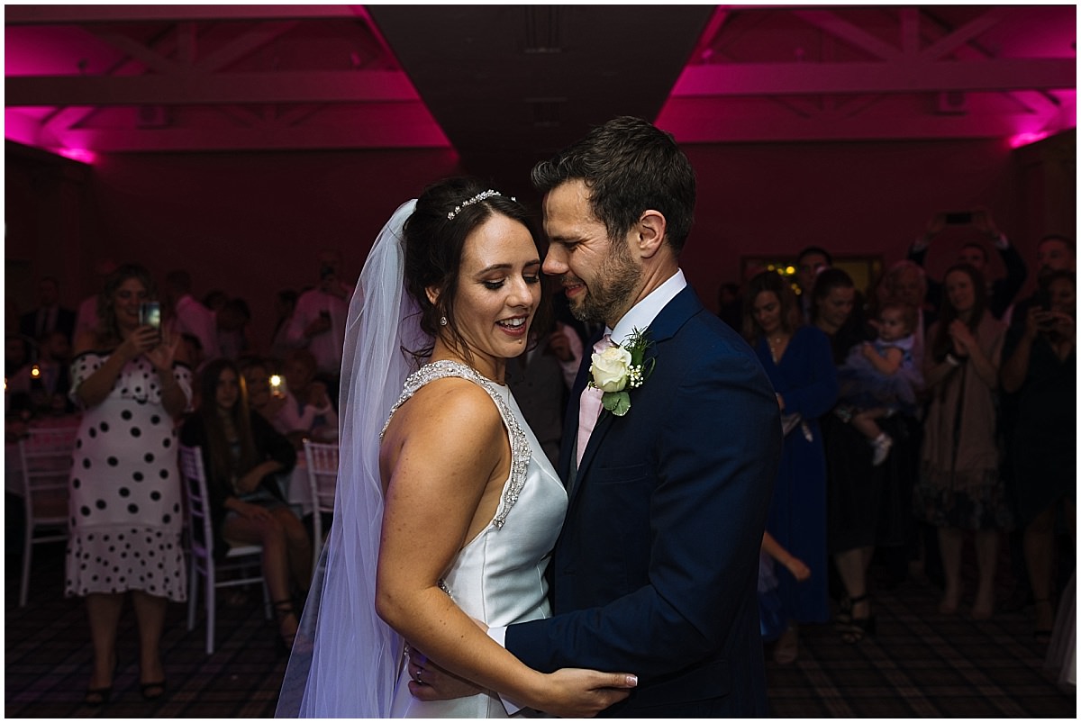 Married couple enjoy their first dance at Carden Park Wedding