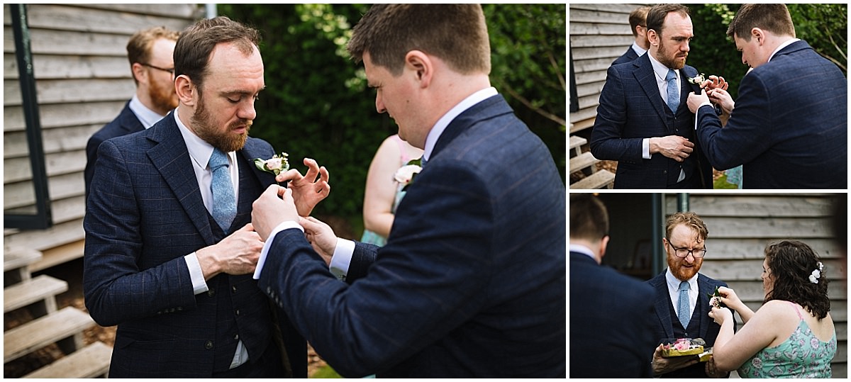 groom and groomsmen put on button holes