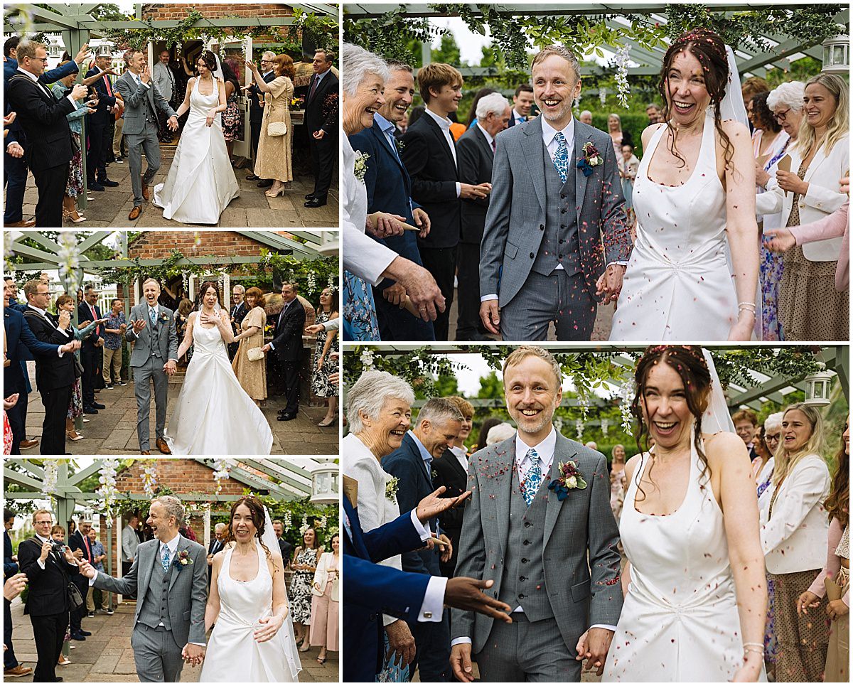 A couple joyfully exits their wedding ceremony surrounded by smiling guests, while being showered with confetti in a picturesque outdoor setting at cheshire's abbeywood estate