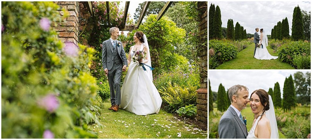 A couple walking hand-in-hand through a lush garden, surrounded by vibrant flowers and greenery, celebrating their special day at abbeywood estate in cheshire