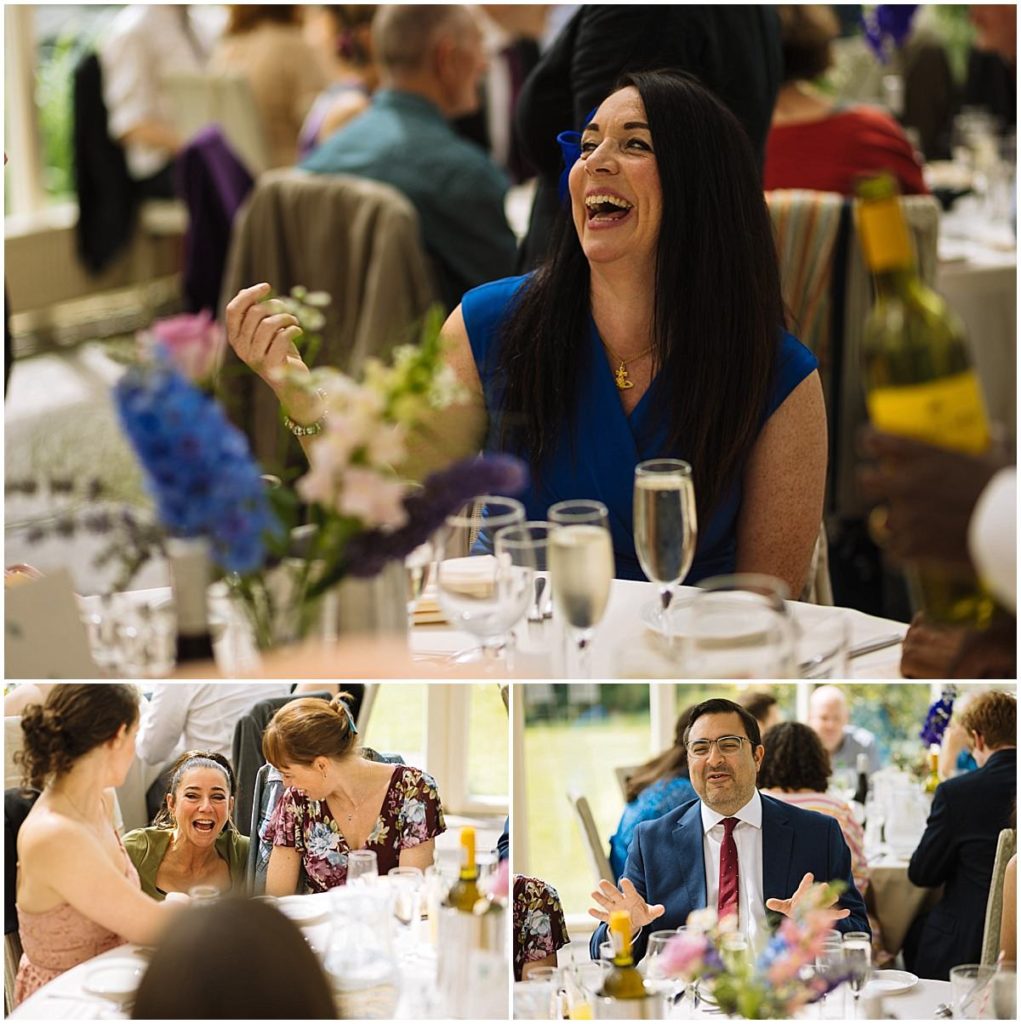 Guests engaged in lively conversation and laughter during a festive gathering, surrounded by floral decorations and elegant dining setups.