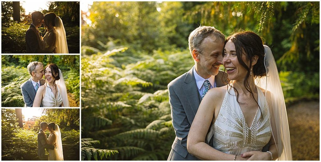 A joyful couple shares affectionate moments in a lush green setting, surrounded by ferns.