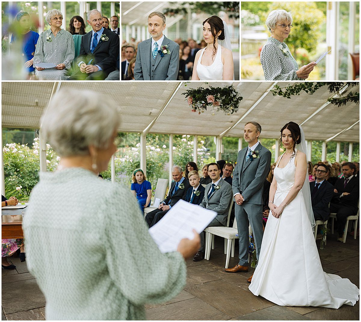 A couple stands before a officiant during their wedding ceremony, surrounded by family and friends in a beautifully decorated indoor setting filled with greenery and flowers.